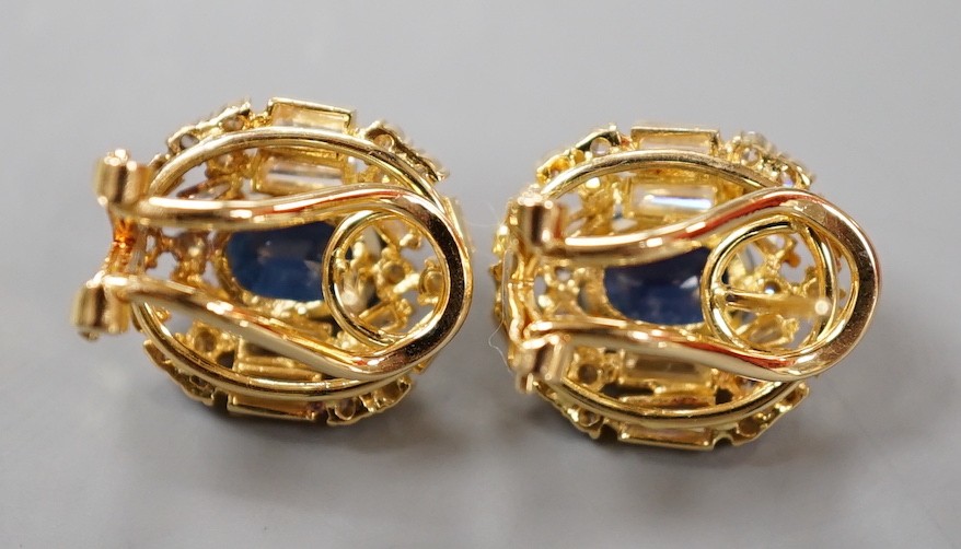 A pair of modern 750 yellow metal, sapphire and diamond set oval cluster earrings, 16mm, gross weight 8.2 grams.